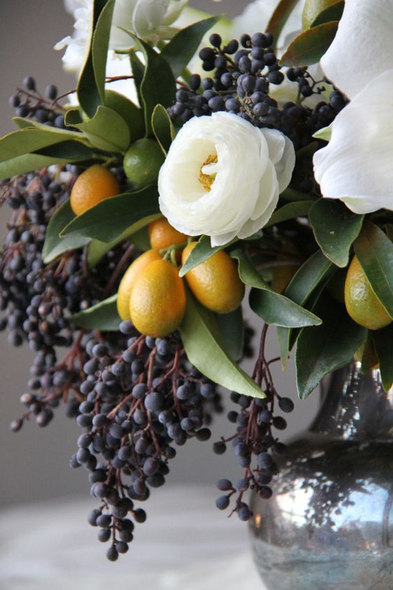 dramatic flare white flower with berries in a mercury vase